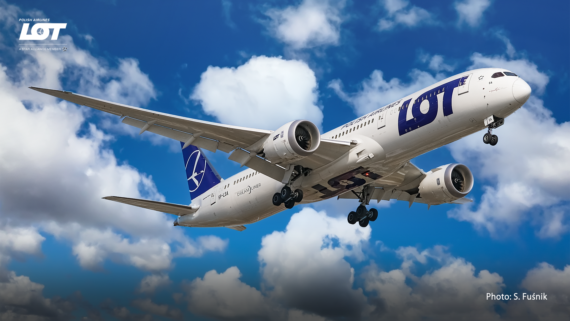 Passenger airplane against a sky with clouds.
